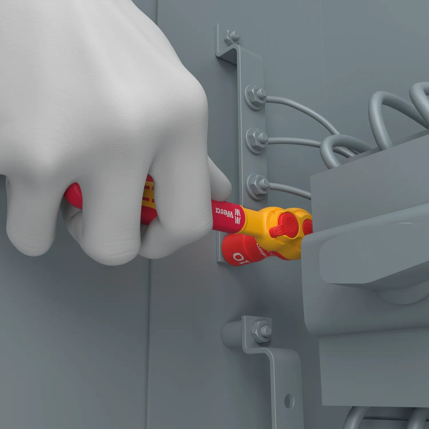The Wera Zyklop VDE ratchet being used inside an electrical control cabinet, highlighting its slim head and 1,000V safety rating.