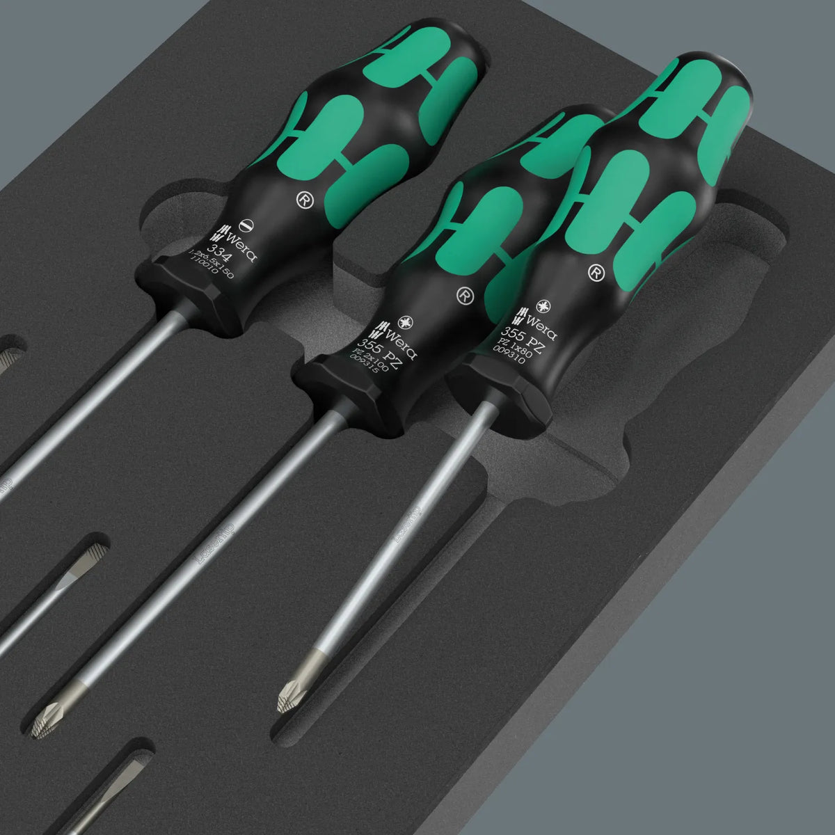 Close-up view of Wera Kraftform Series 300 Pozidriv and slotted Lasertip screwdrivers resting in a shadow foam insert