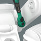 The Wera Zyklop Comfort 1/4" drive ratchet being used with an imperial socket and extension on an industrial component, highlighting the tool's reach and grip.