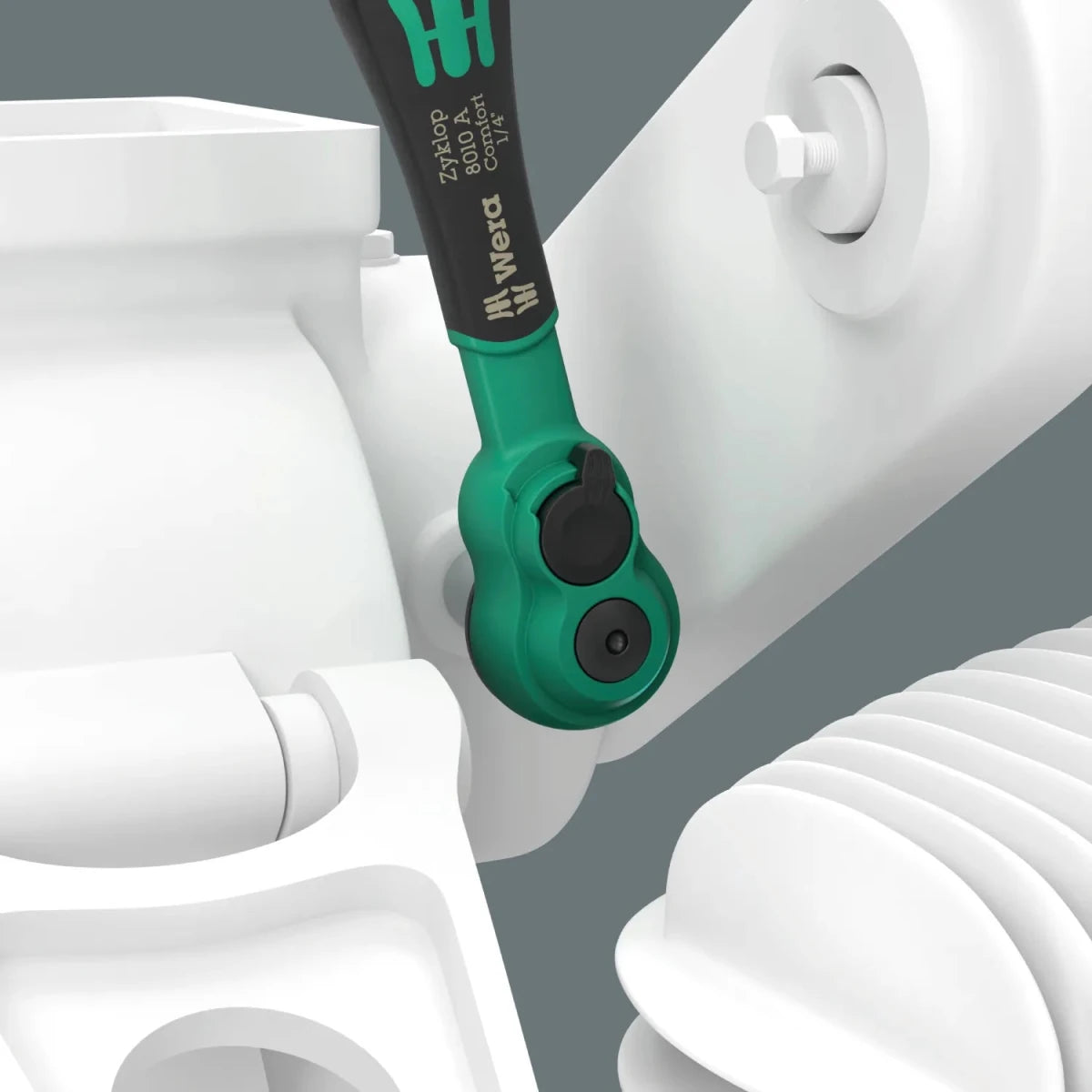 The Wera Zyklop Comfort 1/4" drive ratchet being used with an imperial socket and extension on an industrial component, highlighting the tool's reach and grip.