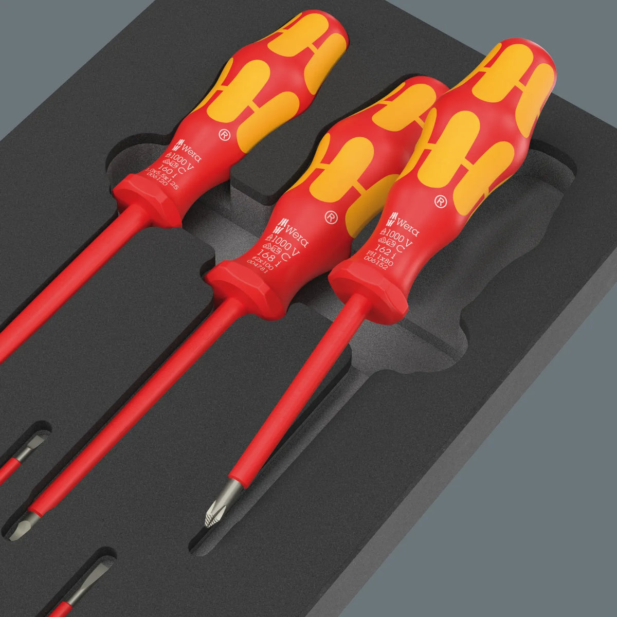 Close-up view of Wera Kraftform Series 100 VDE insulated Phillips and Pozidriv screwdrivers resting in shadow foam insert