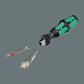 Close-up of a green and black Wera Kraftform screwdriver handle next to a Phillips screwdriver bit and a premium Wera branded metal bottle opener insert.