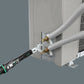 Wera 9558 torque wrench in use tightening brass flare nut fittings on an HVAC outdoor mini-split unit
