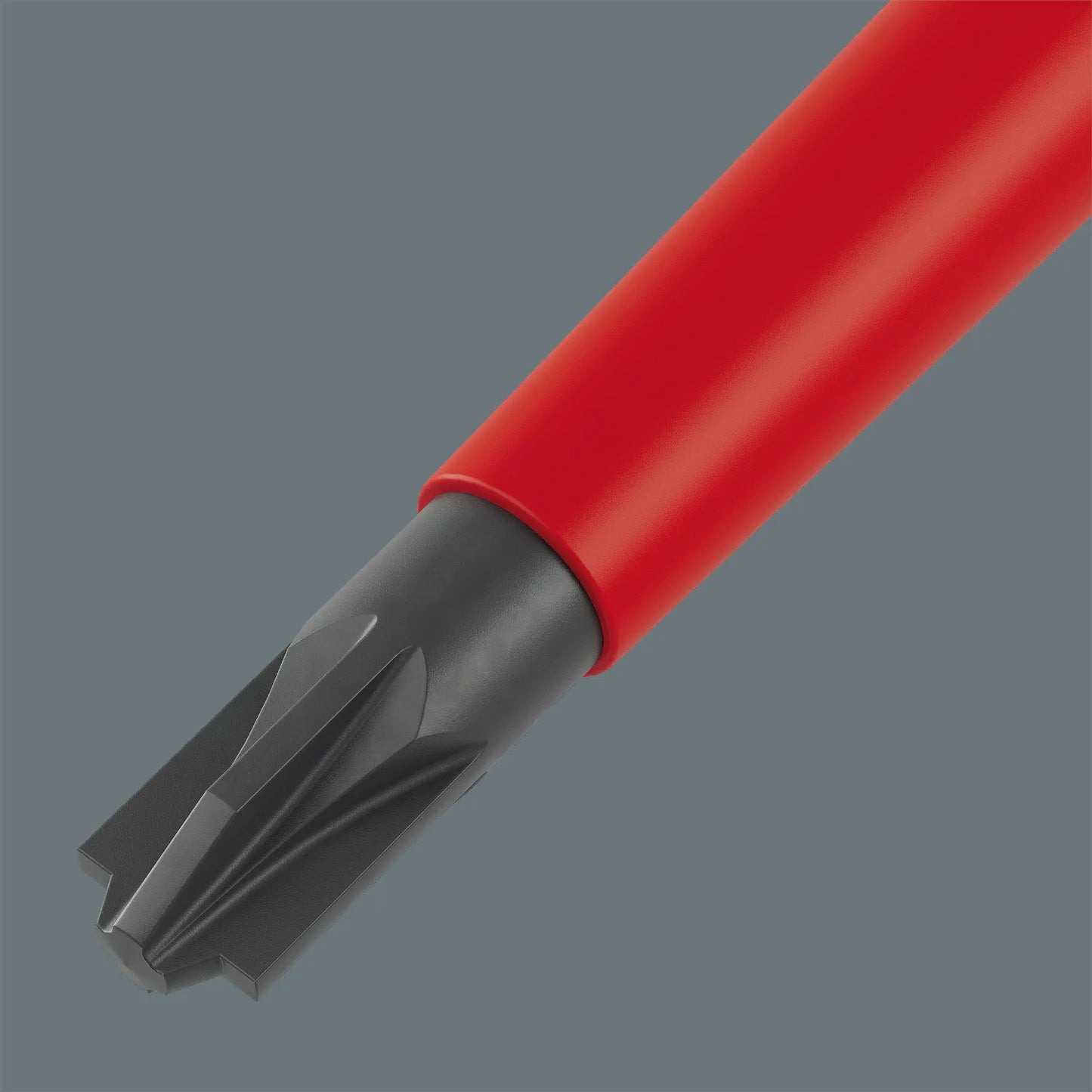 Macro view of a Wera VDE PlusMinus PZ/S combination screwdriver tip for electrical terminal blocks.